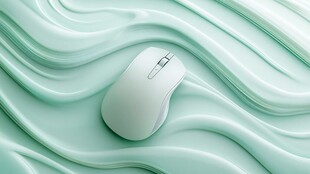 淡绿波纹上的精致无线鼠标