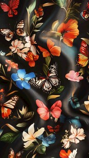 黑色底花卉蝴蝶印花布料