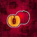 红色背景中的切开桃子