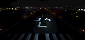 鸟瞰航拍飞机降落机场跑道夜景