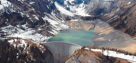 航拍雪山水库大坝鸟瞰水面风光