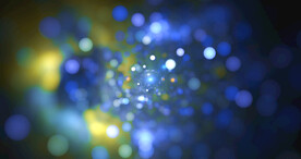 蓝色光影斑点晚会粒子舞台背景