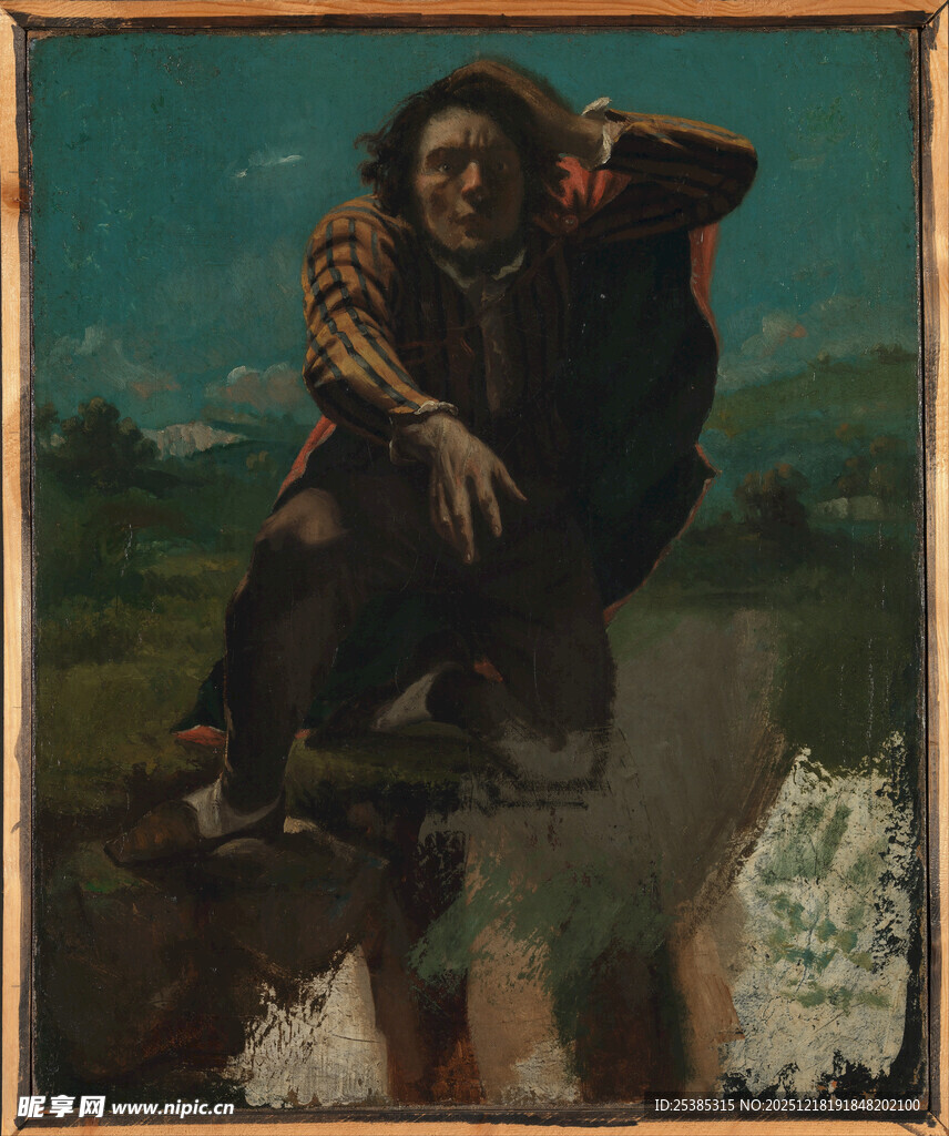 孤独男子坐于户外岩石上