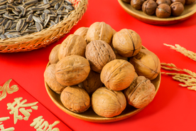 核桃零食红色背景海报素材