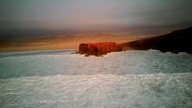 高清傍晚红日海滩美景