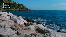 近镜头海浪拍打岸边礁石