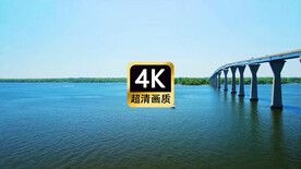 航拍游艇经过跨海大桥下