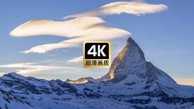 风景素材雪山顶上飘过的云层