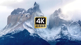 航拍云雾笼罩的雪山山顶