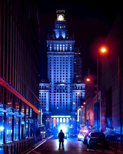 城市夜景下的行人与高楼