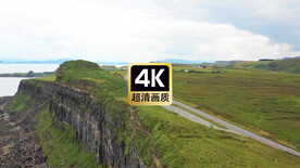 航拍素材海岸边公路上行驶的汽车